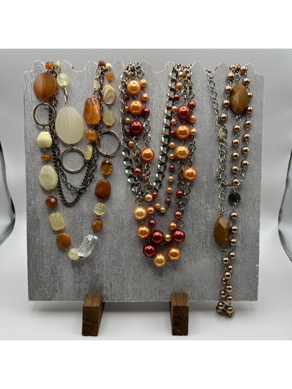 Layered Beaded & Chain Necklaces Featuring Warm Tones Of Amber Cream Bronze And